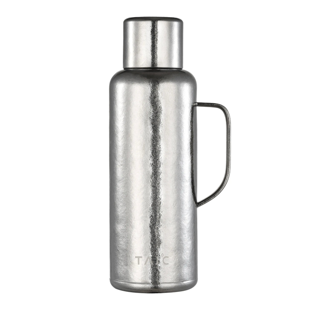 Pure titanium 1.2L thermal carafe in polished silver finish with side handle and screw cap, front view