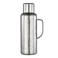 Pure titanium 1.2L thermal carafe in polished silver finish with side handle and screw cap, front view