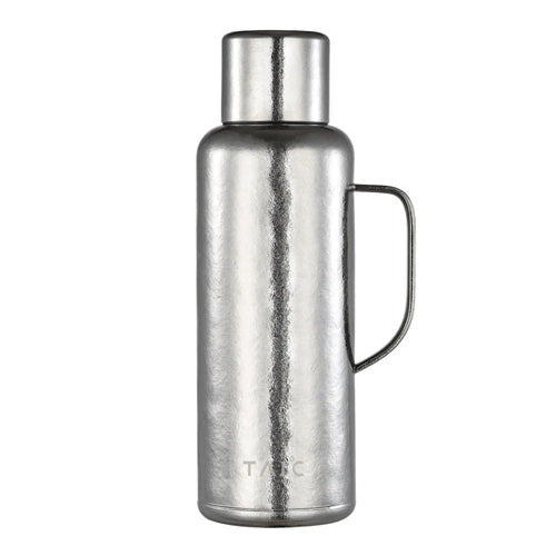 Pure titanium 1.2L thermal carafe in polished silver finish with side handle and screw cap, front view