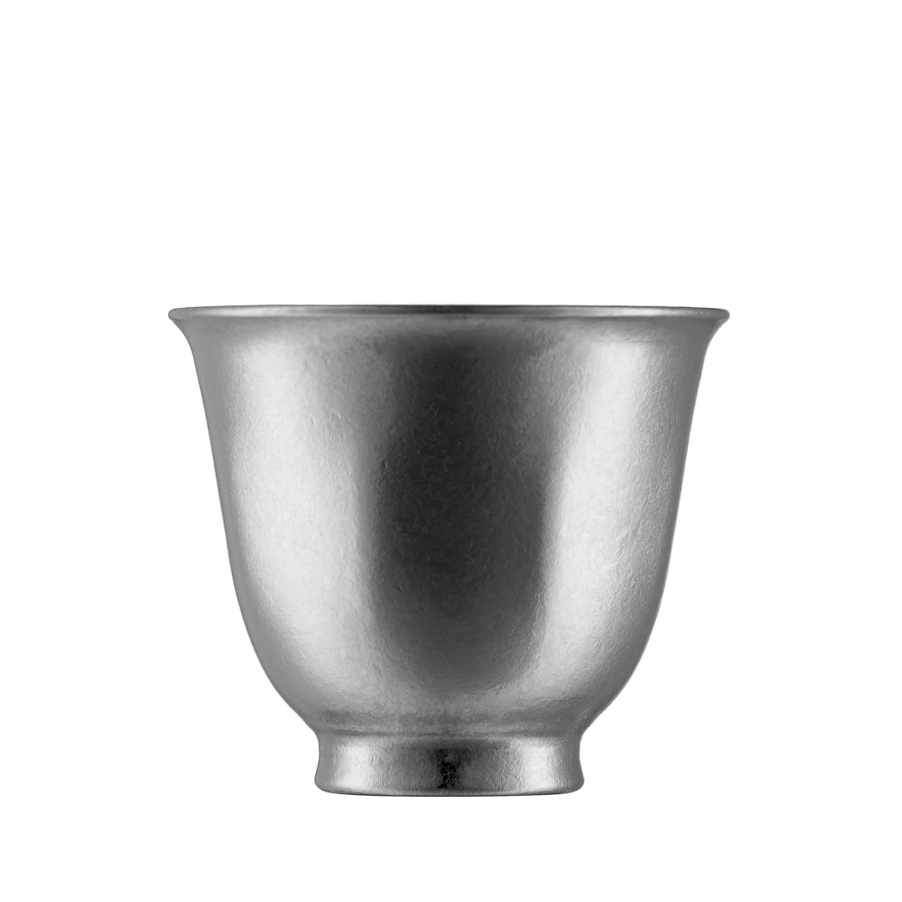 Single matte pewter-silver pure titanium double-wall tea cup, front view on plain white background
