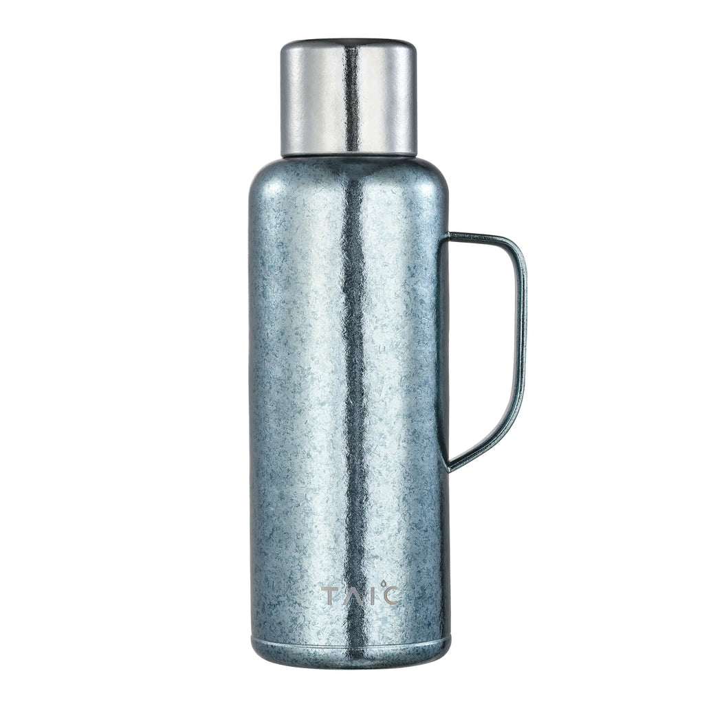 Pure titanium 1.2L thermal carafe in frosted ice-blue crystalline finish with silver cap and handle, front