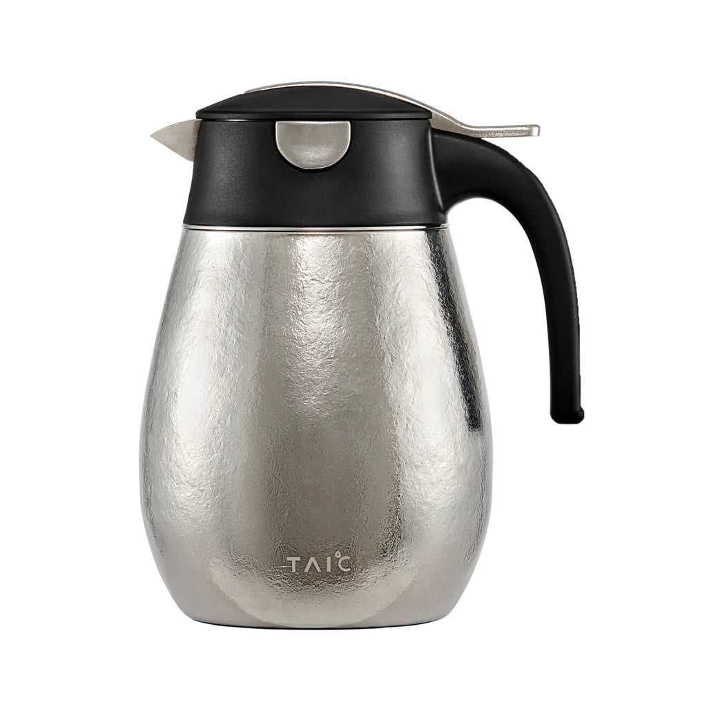 Pure titanium 1L thermal carafe in hammered silver finish, front profile with black lid and handle