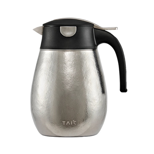 Pure titanium 1L thermal carafe in hammered silver finish, front profile with black lid and handle