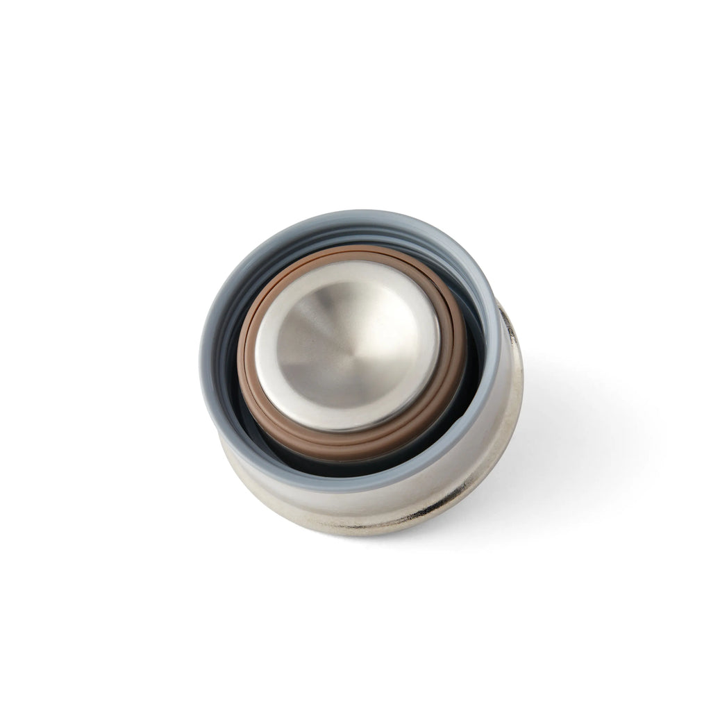 Pure titanium office mug lid close-up showing silicone sealing gaskets from a top-down angle