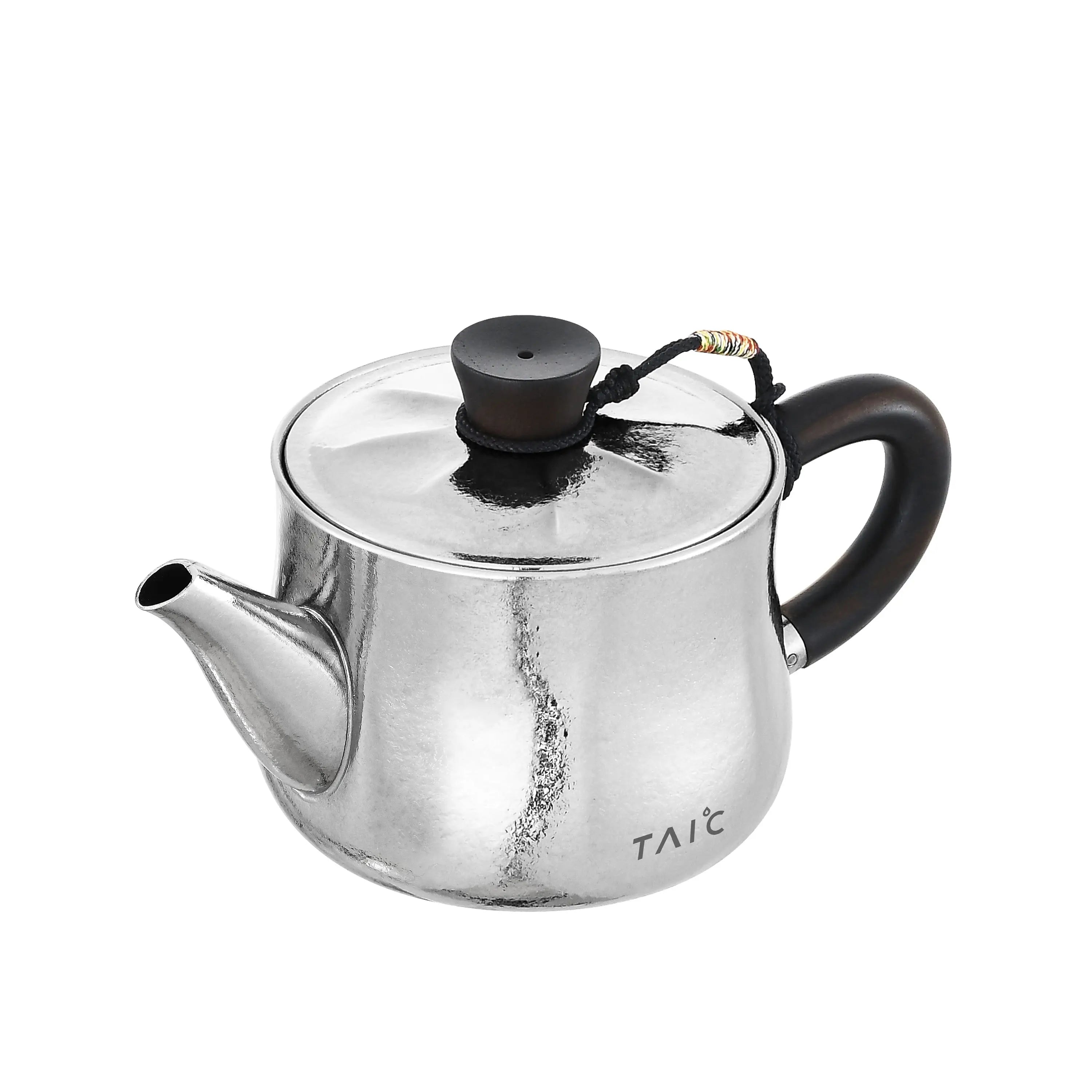 Polished titanium teapot, raised three-quarter angle showing lid, spout and blackwood handle