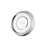 Close-up of titanium mug lid engraved 'Designed by TAIC Ti Lumina Series', top view