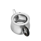 Titanium teapot with lid off, top-down view of interior and built-in honeycomb strainer at spout