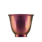 Single magenta-and-gold iridescent pure titanium double-wall tea cup, front view on white background