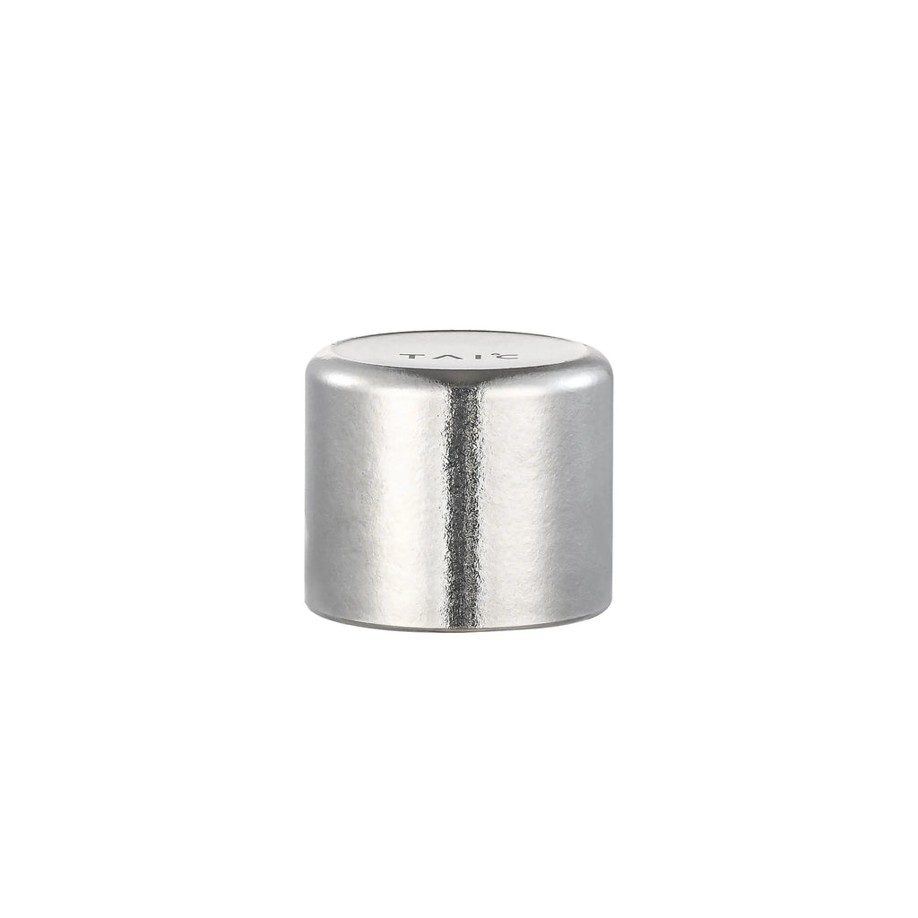 Detached pure titanium cup cap of thermal carafe, closed side view with TAIC engraving on the top