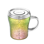 Rainbow-finish titanium mug with screw-on lid engraved TAIC, angled top-down view