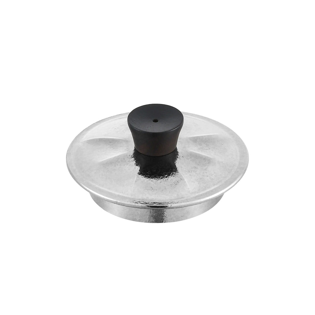 Titanium teapot lid close-up, hammered silver surface with blackwood knob and steam vent hole