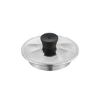 Titanium teapot lid close-up, hammered silver surface with blackwood knob and steam vent hole