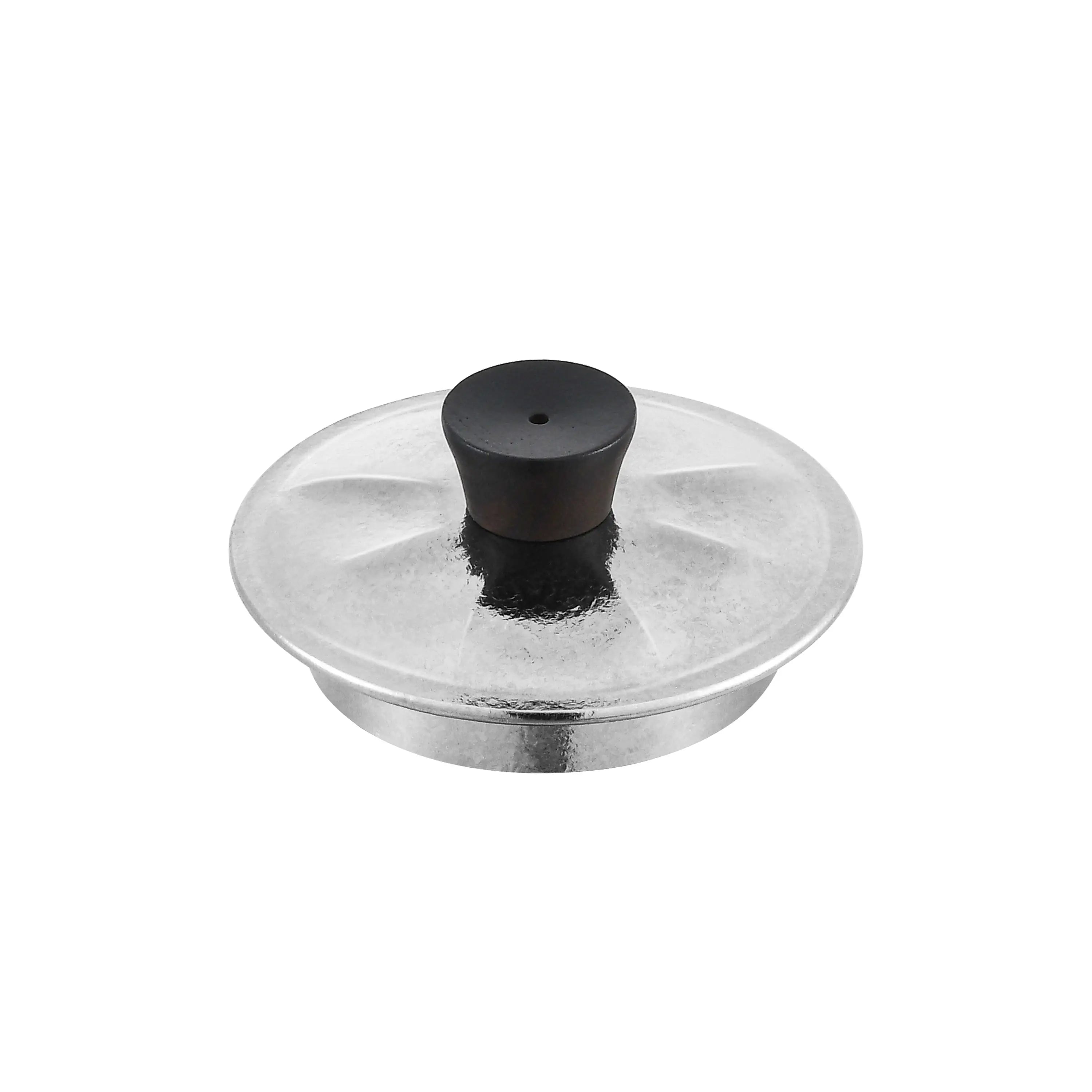 Titanium teapot lid close-up, hammered silver surface with blackwood knob and steam vent hole