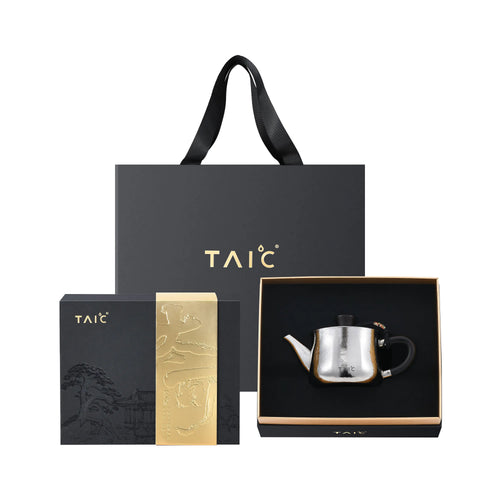 Pure titanium teapot gift set with black presentation box, gold scroll insert and branded tote bag