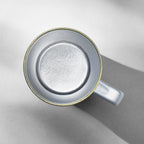 Top-down view into an empty titanium mug showing its seamless wide-mouth interior liner