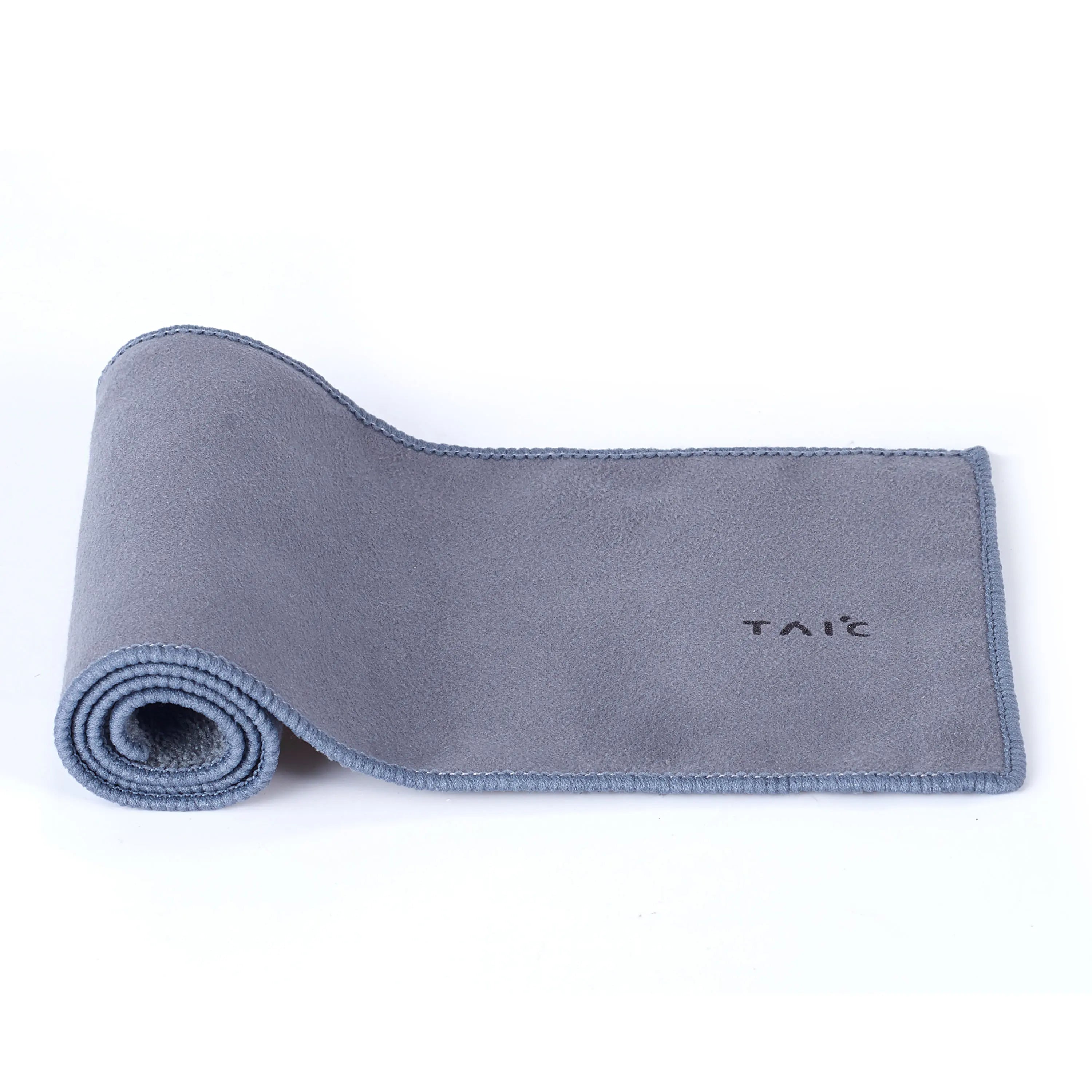 Pure titanium travel tea set accessory, grey microfiber tea towel partly rolled on white background